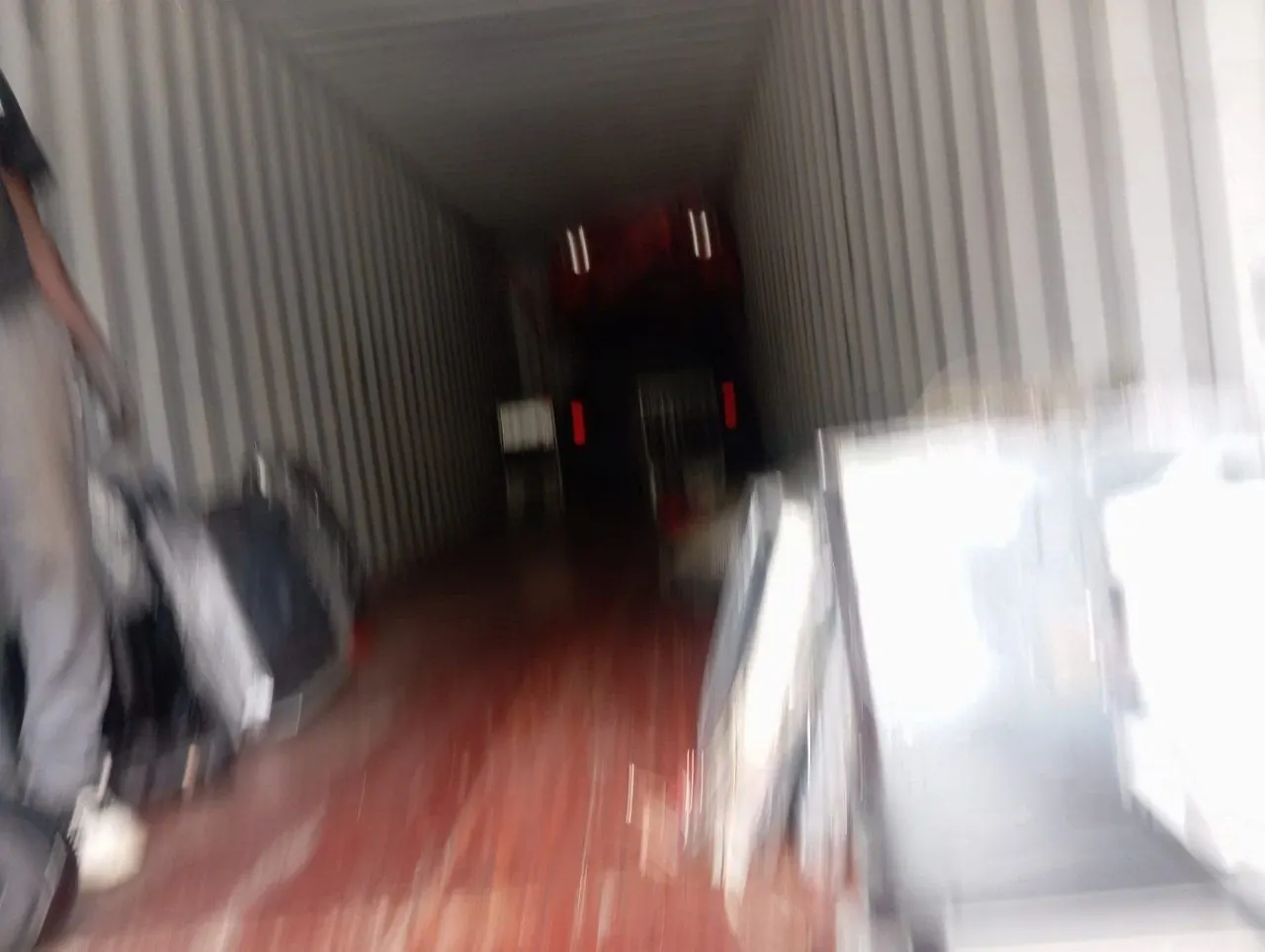 Inside a shipping container during loading