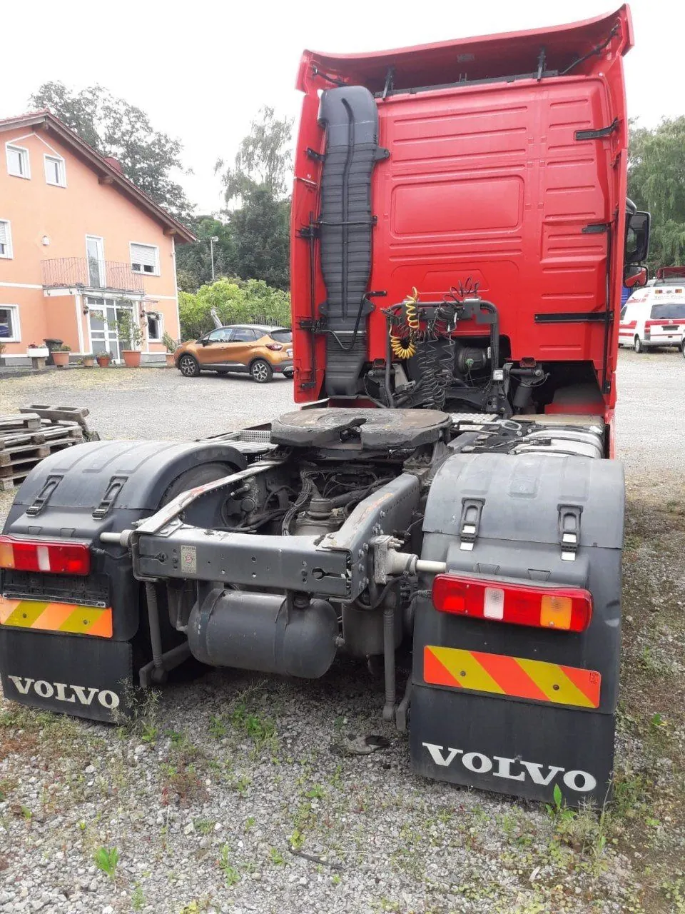 Rear view of a red Volvo FH tractor unit